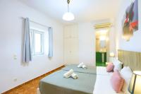 Łóżko lub łóżka w pokoju w obiekcie Paola House