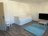 Postel nebo postele na pokoji v ubytování Apartmán Batman