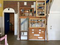 a room with a bunk bed and a book shelf at Sea House in Magong