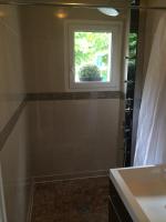 a bathroom with a sink and a window at Hôtel Saint Alban in Saint-Maur-des-Fossés