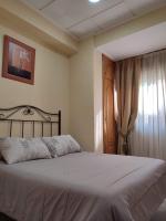 Posteľ alebo postele v izbe v ubytovaní Hotel Beatriz