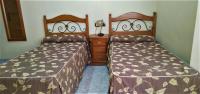 Posteľ alebo postele v izbe v ubytovaní Hotel Beatriz