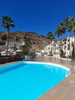 Bazén v ubytování Vista Bella - Planta baja al lado de la piscina - Ground floor by the pool nebo v jeho okolí