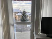 Televízia a/alebo spoločenská miestnosť v ubytovaní Zimmer & Appartements am Schloßplatz