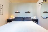 A bed or beds in a room at Top Living Apartments - Torino Centro