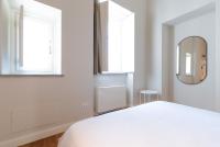 A bed or beds in a room at Top Living Apartments - Torino Centro