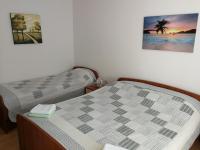 Posteľ alebo postele v izbe v ubytovaní APARTMANI BAN