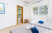 Posteľ alebo postele v izbe v ubytovaní 3 Bedroom Awesome Home In Porto Petro