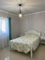 Postel nebo postele na pokoji v ubytování Alojamento King´s Village