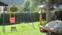 a playground with a rock and a swing at Haus Krößbacher in Fulpmes
