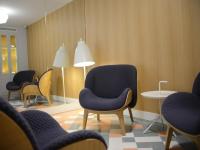 a waiting room with chairs and a table at Hotel le Lapin Blanc in Paris