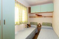 Posteľ alebo postele v izbe v ubytovaní Club del Sole Rivaverde Easy Camping Village