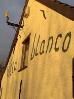a sign on the side of a building with the word bilacco at Villa Blanco in Opwijk