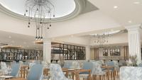 a dining room with tables and chairs and chandeliers at Hotel Riu Madeira - All Inclusive in Caniço