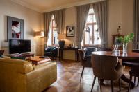 a living room with a couch and a table at Boutique Hotel Nautilus in Tábor