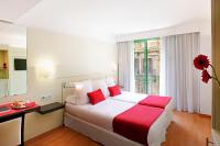 Postel nebo postele na pokoji v ubytování Grupotel Gravina