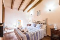 Postel nebo postele na pokoji v ubytování Villa Capo