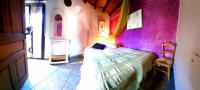 A bed or beds in a room at La Dueña I