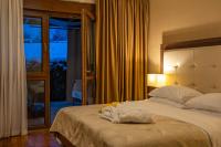 Postel nebo postele na pokoji v ubytování Hotel Degenija