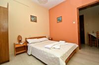 Postel nebo postele na pokoji v ubytování Nina Apartments