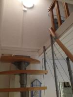 a room with wooden stairs in a building at CAP D&#39;AGDE studio cabine 6 pers. + terrasse + parking privé + clim (calme) in Cap d&#39;Agde