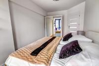 Posteľ alebo postele v izbe v ubytovaní Apartament Gwiazda Perła Krynicy