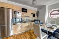Kuchyňa alebo kuchynka v ubytovaní Apartament Gwiazda Perła Krynicy