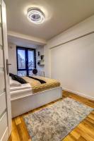 Posteľ alebo postele v izbe v ubytovaní Apartament Gwiazda Perła Krynicy