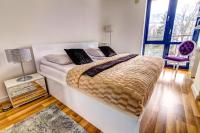 Posteľ alebo postele v izbe v ubytovaní Apartament Gwiazda Perła Krynicy