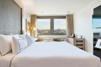 A bed or beds in a room at Melia Madrid Princesa