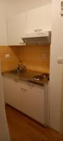 Kuchyňa alebo kuchynka v ubytovaní Apartment Zsa Zsa Zenta 1