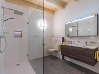 a bathroom with a shower and a toilet and a sink at Dani&#39;s Ferienwohnung in Söll
