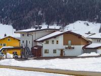a group of buildings with snow on the ground at Dani&#39;s Ferienwohnung in Söll