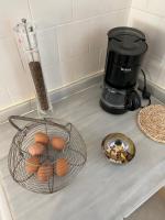 a counter with a basket of eggs and a blender at Chez Hélène 3 étoiles, labellisé disabled PMR,pour 4 personnes chiens bienvenus-pet friendly in Bourg-Madame