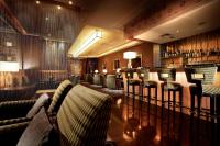a bar with couches and chairs in a restaurant at Park Plaza Beijing Wangfujing in Beijing