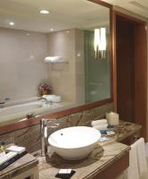 a bathroom with a sink and a large mirror at Park Plaza Beijing Wangfujing in Beijing