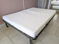 a mattress on a bed frame in a room at Appartement cosy avec parking proche port et plage in Cap d&#39;Agde