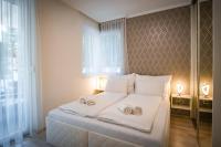 Posteľ alebo postele v izbe v ubytovaní MyFlat Diamond Bay Apartment