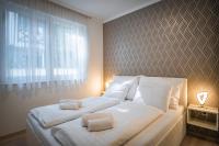 Posteľ alebo postele v izbe v ubytovaní MyFlat Diamond Bay Apartment