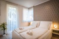 Posteľ alebo postele v izbe v ubytovaní MyFlat Diamond Bay Apartment
