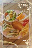 a plate of food with a sandwich and french fries at Locking B&amp;B台東民宿 in Taitung City