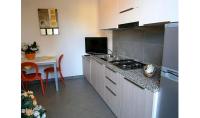 A kitchen or kitchenette at Condominio Quadrangolo-Gemini