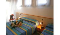A bed or beds in a room at Condominio Quadrangolo-Gemini