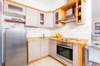 Kuchyň nebo kuchyňský kout v ubytování Apartments Dea Caeli