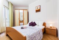 Postel nebo postele na pokoji v ubytování Apartments Dea Caeli