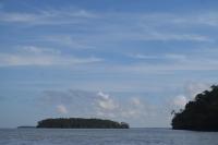 a large body of water with trees in the distance at Pousada Grão in Belém