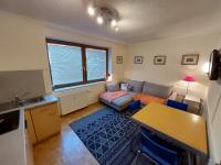 A bed or beds in a room at Appartementanlage Thermenblick SKI IN & SKI OUT