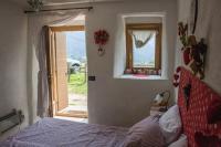 Posteľ alebo postele v izbe v ubytovaní CASA BERNARD Zortea VANOI cuore verde del Trentino