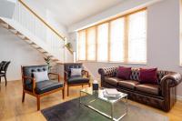 a living room with a couch and two chairs at 196 Bishopsgate in London