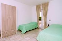 A bed or beds in a room at Brezza dell'Alento